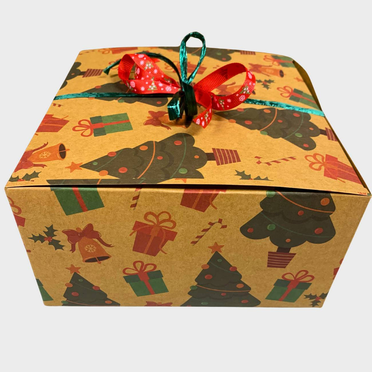 Gift box with Christmas tree design and ribbon on a white background