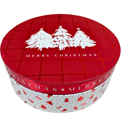 Round red and white Christmas gift box with a holiday pattern featuring three white pine trees and a Merry Christmas greeting.