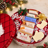 Premium round Christmas gift box filled with 6 bars of artisan goat milk soap, decorative candy canes, a mitten-shaped soap, and a stocking-shaped soap