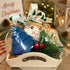 Handmade holiday goat milk soap gift crate featuring a blue pine tree shaped soap and a Sleigh Bells holiday bar soap.