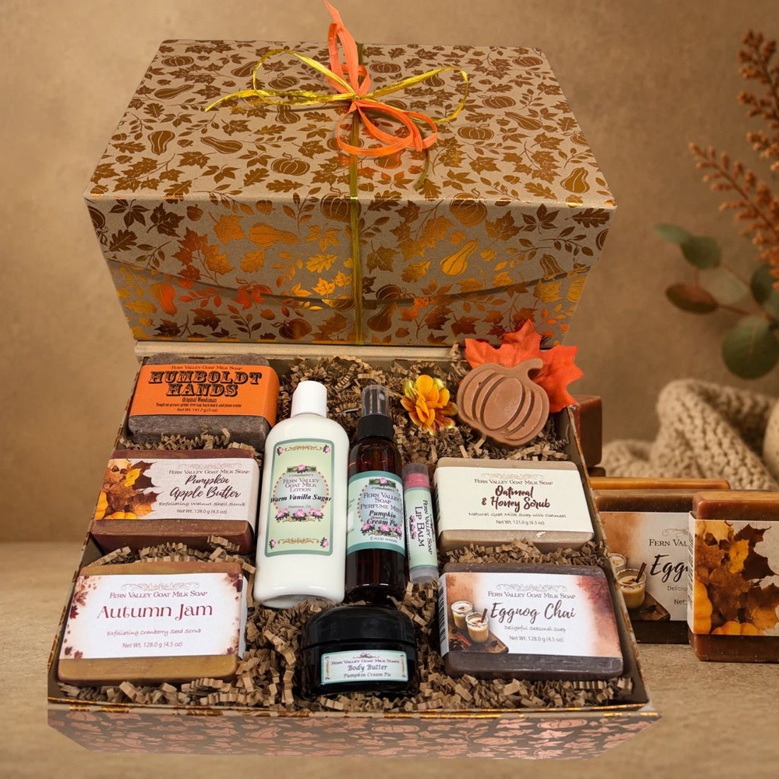 Open autumn harvest gift chest filled with five Fern Valley goat milk soaps, Warm Vanilla Sugar lotion, pumpkin body butter, perfume mist, and a lip balm.